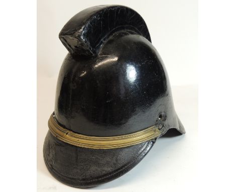 An early black leather firemans helmet with high comb and brass band to the front ++lacks side bosses