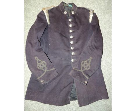 An early 20th Century London Private Fire Brigades Assoc officers tunic with white metal scale epaulettes, original white met