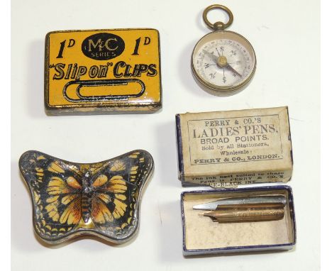A late 19th/early 20th Century tin shaped as a butterfly with coloured litho detail, contains some pen nibs; another small ti