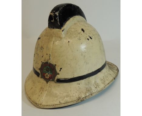 A West Yorkshire Fire Service helmet, white with black comb and black tape line, with original printed badge, original brown 