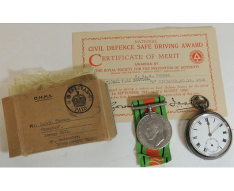 A WWII Defence medal in postage box, a Certificate of Merit (Civil Defence National Fire Service) and a silver cased open fac