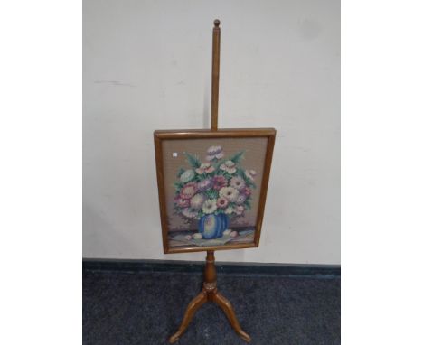 A late 19th century tapestry pole screen 