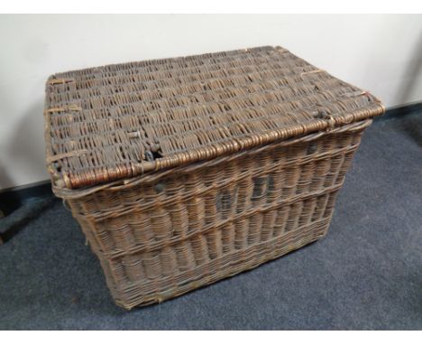 An antique wicker hamper containing a quantity of Christmas decorations 