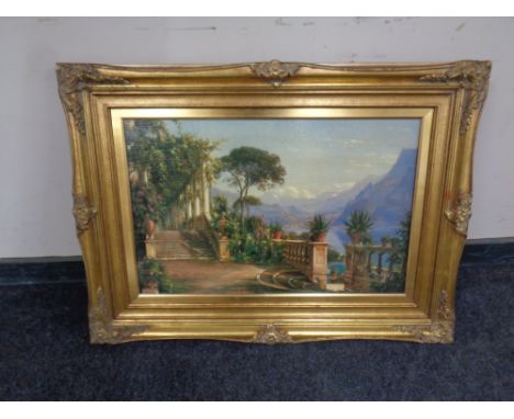 A print depicting a lake scene viewed from a villa in ornate gilt frame.
