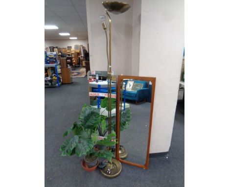 A mid century teak framed hall mirror together with a further hall mirror, brass floor lamp and artificial plant 