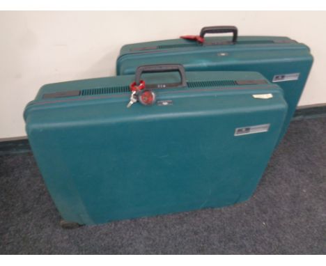 Two vintage Delsey hard shell luggage cases with keys 