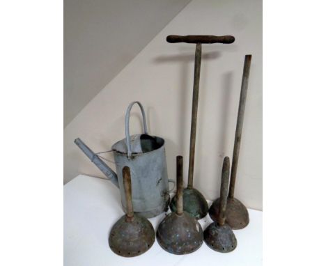 A galvanised British Rail watering can together with five vintage poss sticks