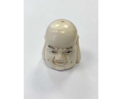 A Japanese carved bone netsuke - Head of Buddha 