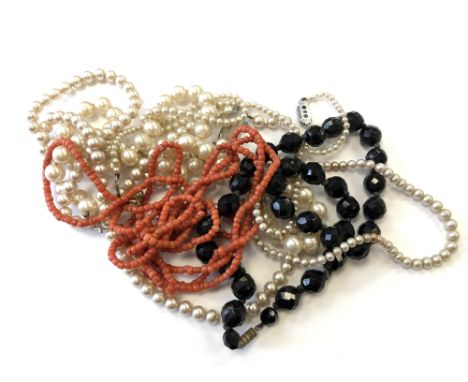 A collection of jet, coral and pearl jewellery