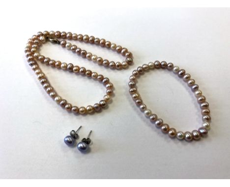 A pearl necklace, bracelet and earrings