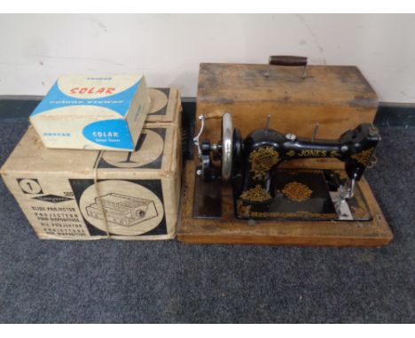 A twentieth century Jones Family CS hand sewing machine in case together with an Sawyers slide projector and Photax colour vi