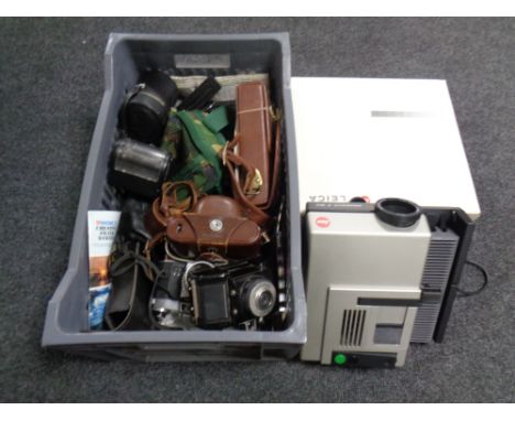 An Leica Pradovit P150 projector, boxed, together with a crate of vintage cameras and accessories 