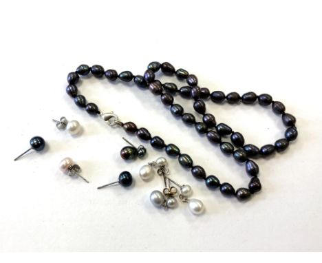 A pearl necklace and various earrings 