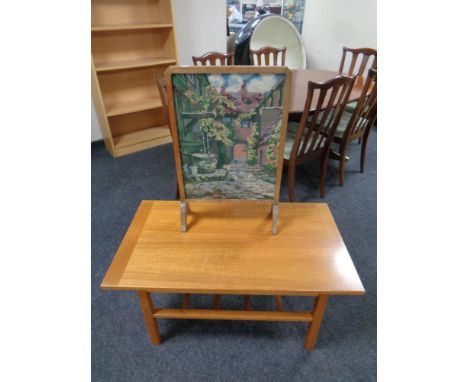 A twentieth century Danish teak coffee table with undershelf together with tapestry fire screen 