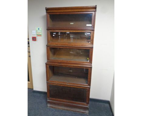 A Globe Wernicke oak five tier stacking bookcase, width 86.5 cm.