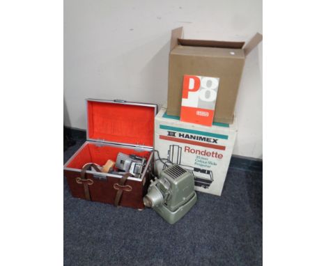 An Hanimex Rondette 35 mm slide projector together with two further projectors by Aldis and Eumig, case containing accessorie