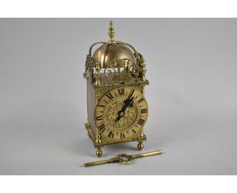 A Reproduction Brass Lantern Clock with Key, 23cms High 