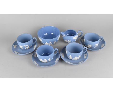 Four Wedgwood Blue Jasperware Cups and Saucers Together with a Milk Jug and Sugar Bowl 