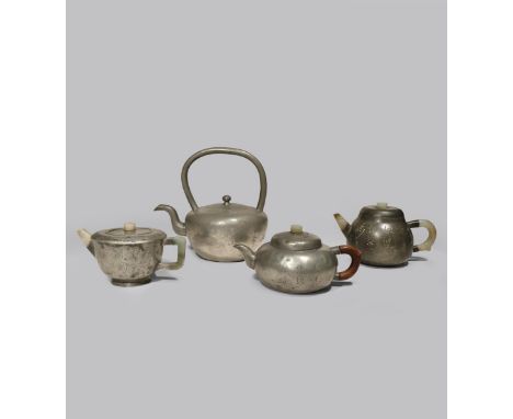 ONE CHINESE PEWTER AND THREE PEWTER-ENCASED YIXING TEAPOTS AND COVERS QING DYNASTY Of circular form, inscribed with poems, tw