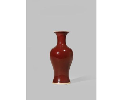 A SMALL CHINESE COPPER-RED BALUSTER VASE 18TH CENTURY With a cylindrical flared neck, the base with a double ring, 13.2cm.