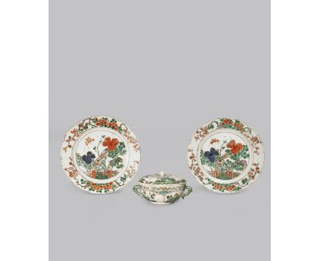 TWO CHINESE FAMILLE VERTE PLATES KANGXI 1662-1722 Painted with pheasants perched on rockwork by fences among colourful peonie