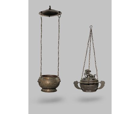 TWO CHINESE BRASS ALLOY HANGING INCENSE BURNERS 19TH CENTURY The larger with three pairs of confronting dragons amidst clouds