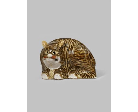 A CHINESE 'TIGER' LANTERN QING DYNASTY The crouching feline with small erect ears and holes for eyes, the reverse with a pier