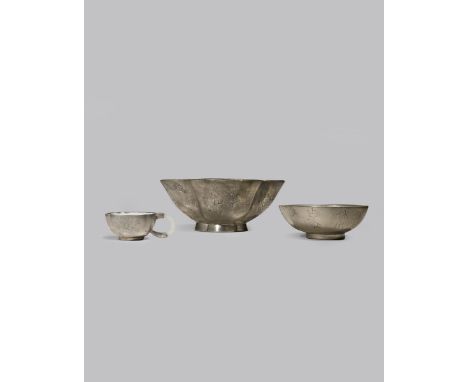 TWO CHINESE YIXING AND PEWTER BOWLS AND ONE CUP 20TH CENTURY Each with a Yixing body coated with white enamel, the large lobe