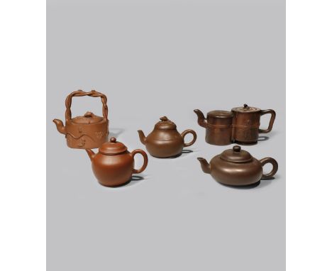 FIVE CHINESE YIXING TEAPOTS AND COVERS QING DYNASTY One shaped as two conjoined cylinders with a chilong to the cover, anothe