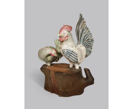AN UNUSUAL CHINESE ENAMELLED YIXING MODEL OF A COCKEREL AND A HEN 19TH CENTURY Naturalistically decorated with coloured ename