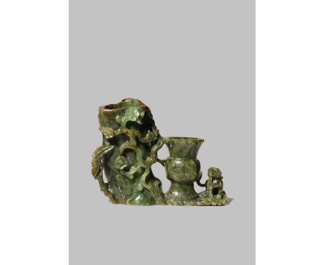 A CHINESE SPINACH-GREEN JADE DOUBLE VASE 19TH CENTURY Carved as a hollowed prunus tree trunk with a flowering branch entangle