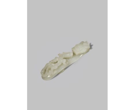 A CHINESE WHITE JADE BELT HOOK 18TH/19TH CENTURY Carved with a dragon head terminal and a smaller sinuous dragon to the body 