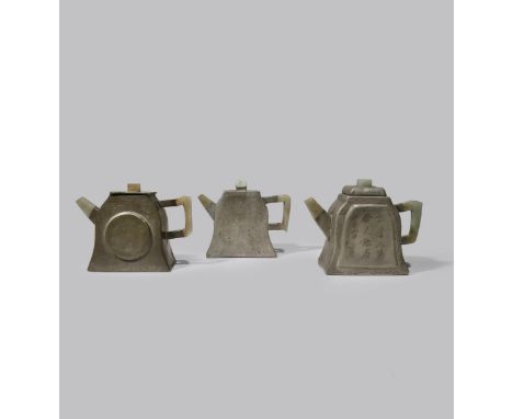 THREE CHINESE INSCRIBED PEWTER-ENCASED YIXING BELL-SHAPED TEAPOTS AND COVERS QING DYNASTY Set with jade handles, knops and sp