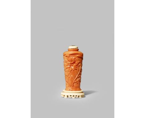 A CHINESE CORAL SNUFF BOTTLE 18TH CENTURY Carved with lilies, hyacinths and bell flowers in shallow relief, with an inlaid Ja