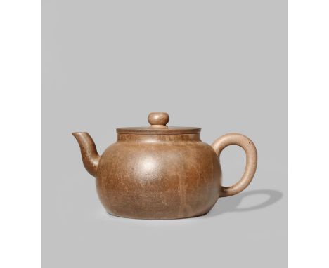 A CHINESE YIXING TEAPOT AND COVER QING DYNASTY With a compressed circular body and simple loop handle, the base with a two ch