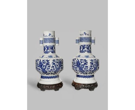 A PAIR OF CHINESE BLUE AND WHITE PHOENIX ARROW VASES 19TH CENTURY The cylindrical bodies painted with stylised phoenix and th