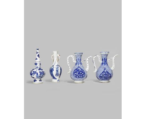 FOUR CHINESE BLUE AND WHITE VESSELS KANGXI 1662-1722 Comprising: a rose water sprinkler, a vase with two dragon head handles 