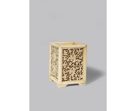 A CHINESE IVORY BRUSH POT LATE MING DYNASTY The square-section body decorated with panels carved with stylised flowerheads an