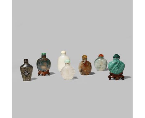 SEVEN CHINESE SNUFF BOTTLES 19TH CENTURY One jadeite, another in white jade, two in agate, one malachite, one laque burgaute 