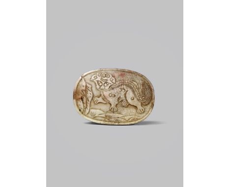 A CHINESE CHICKEN-BONE JADE OVAL BELT BUCKLE 19TH CENTURY Carved with a stylised mythical beast, the reverse with hooks carve