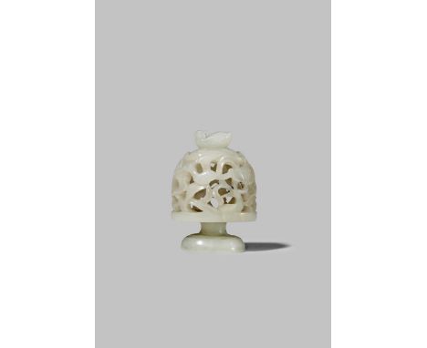 A CHINESE WHITE JADE HAT FINIAL MING DYNASTY Carved as a reticulated dome, decorated with birds and lotus and with a single b