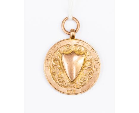 A 9ct rose gold medallion fob engraved to the edge J Buxton K S R H 84.4, weight approx 5.3 gms