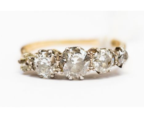 A five diamond diamond dress ring, the central old cut diamond weighing approx 0.60ct, 18ct gold, size O, total gross weight 