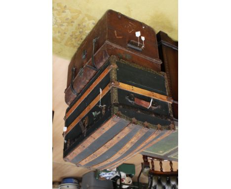 One wooden and metal domed shaped trunk and one metal trunk (2)