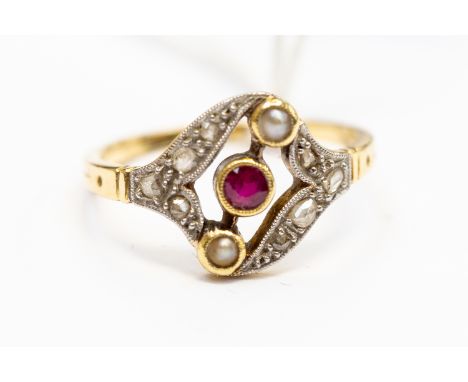 An Edwardian ruby seed pearl and diamond set 18 ct gold ring