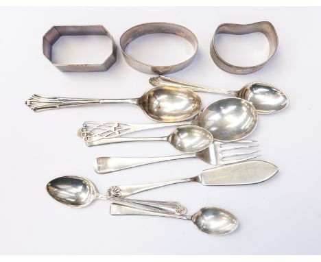 A collection of assorted silverware, comprising two teaspoons, four coffee spoons, cake fork, cake slice, and three silver na