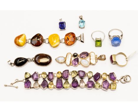 A collection of silver and white metal stone set jewellery including a moonstone, amethyst and pearl pendant, two amber set p