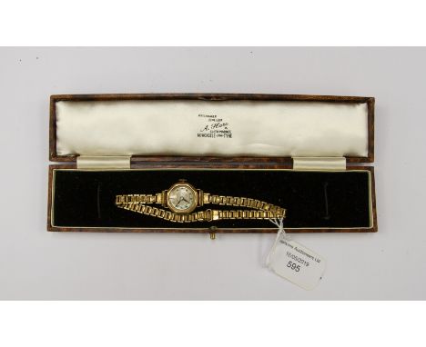 A ladies 9ct gold early 20th century Medana watch, mother of pearl accents to dial, housing with a rolled gold bracelet repla