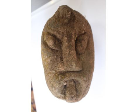  A carved head of grotesque form - architectural salvage