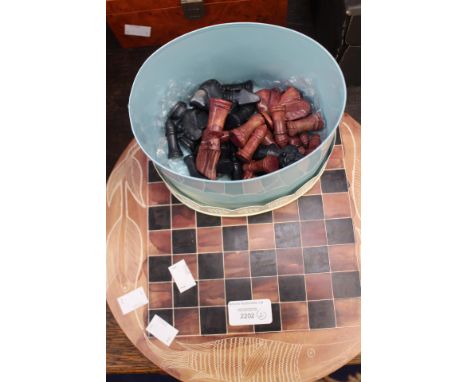 A Kenyan 1970's soapstone chess set with engraved circular board (the chessmen are in a Laura Ashley tin)
